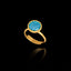 Gold plated 925 sterling silver adjustable ring featuring a round faceted synthetic turquoise gemstone in a bezel setting.