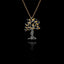 Oxidised silver olive tree pendant with gold leaves on a chain against a black background