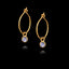 Gold hoop earrings with gemstones on a black background