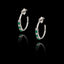 Silver hoop earrings with emerald cz and zircon gemstones on a black background