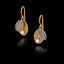 A pair of silver drop earrings featuring one gold textured leaf, one silver leaf, and a small white pearl at the base.