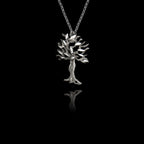 Perspective view of a Silver olive tree pendant on a chain against a black background