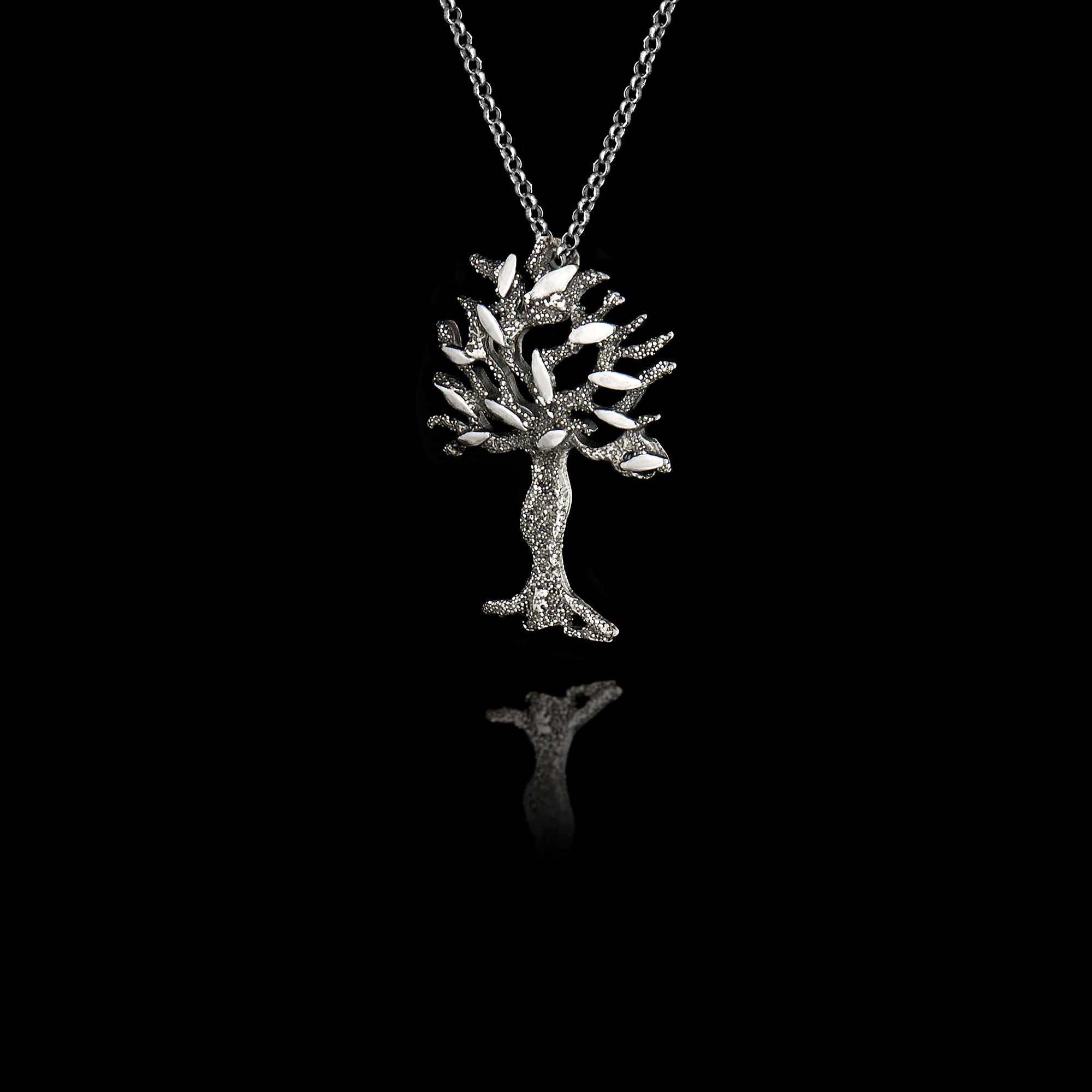 Perspective view of a Silver olive tree pendant on a chain against a black background
