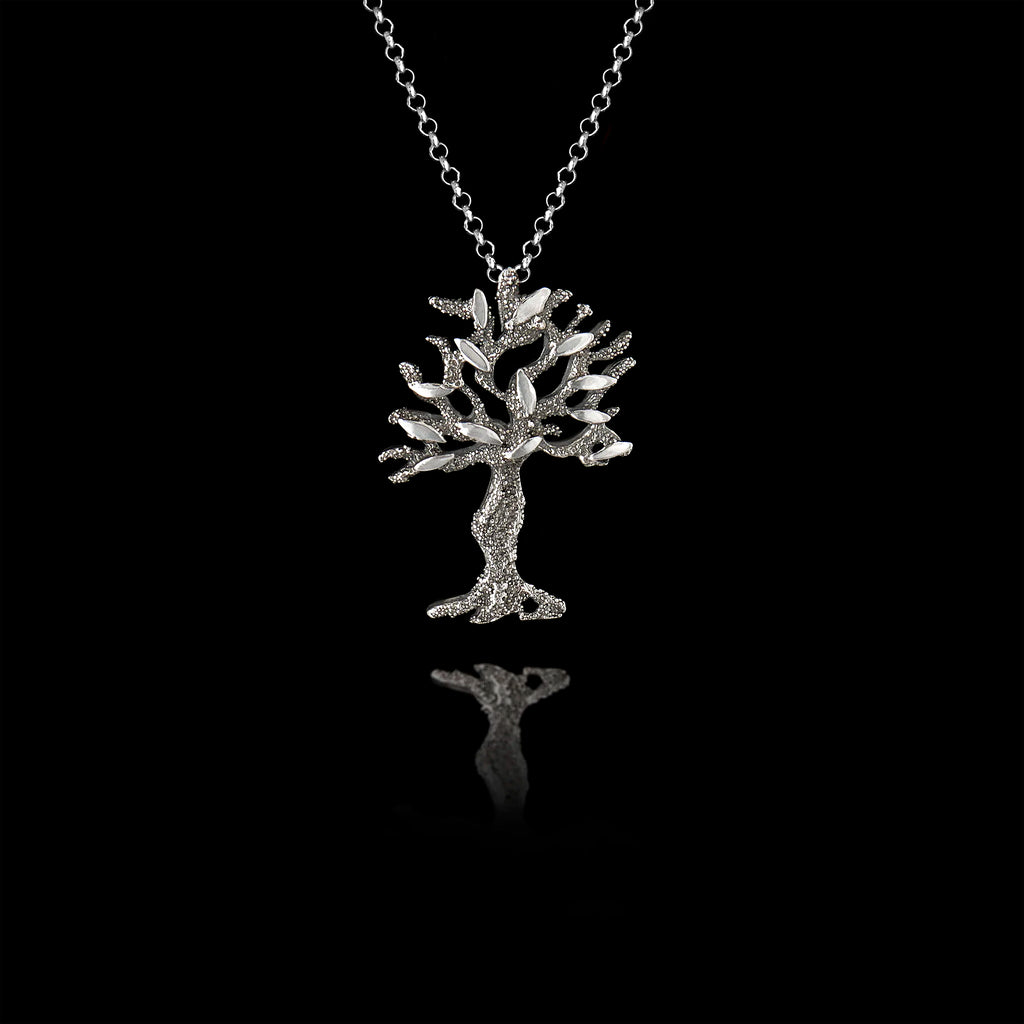 A silver olive tree pendant with oxidized and rhodium finishes.