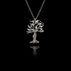 A silver olive tree pendant with oxidized and rhodium finishes.