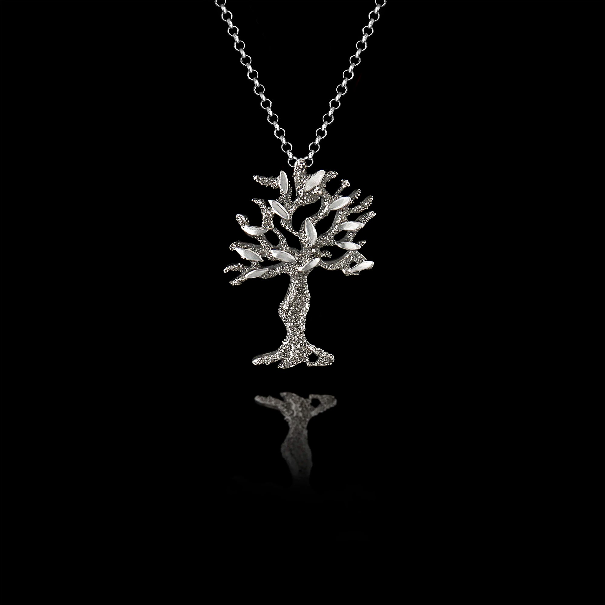 A silver olive tree pendant with oxidized and rhodium finishes.