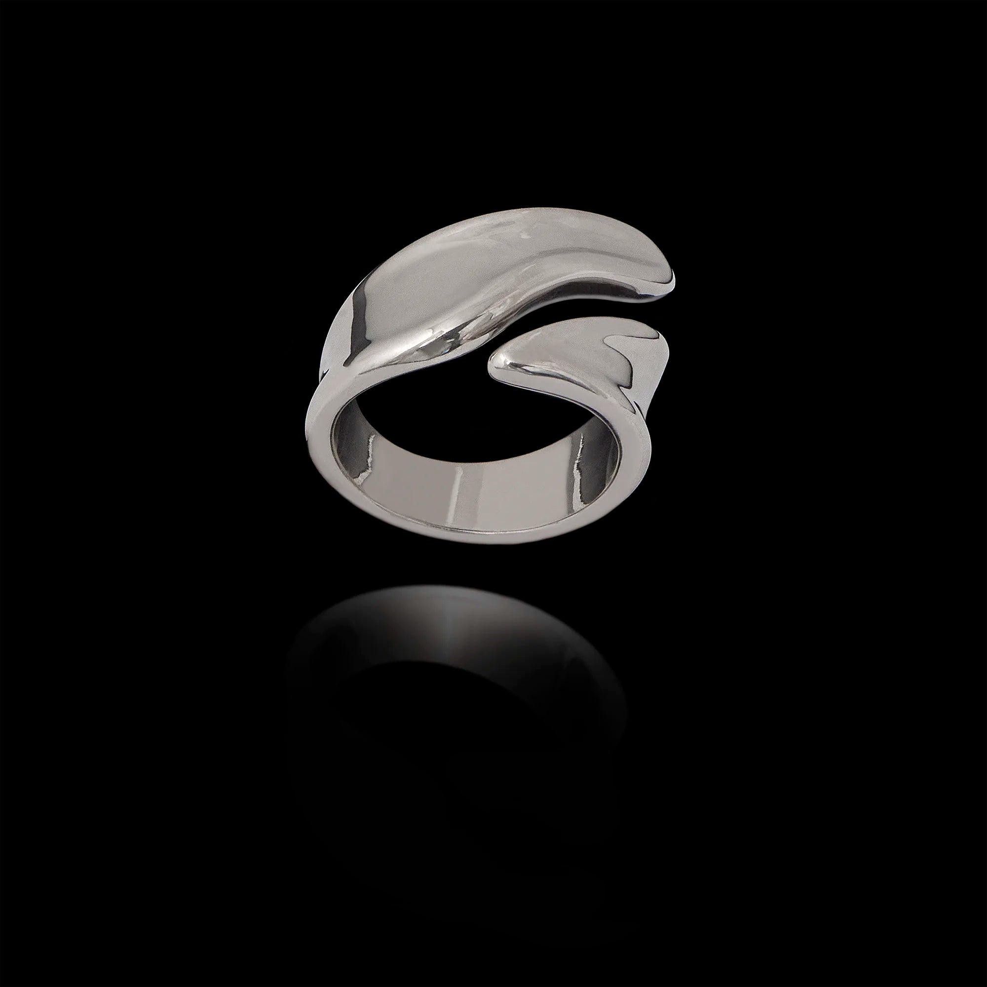 Silver ring with a wave design on a black background