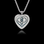 Heart-shaped 925 sterling silver pendant featuring a ceramic insert with an intricate Celtic love knot design.