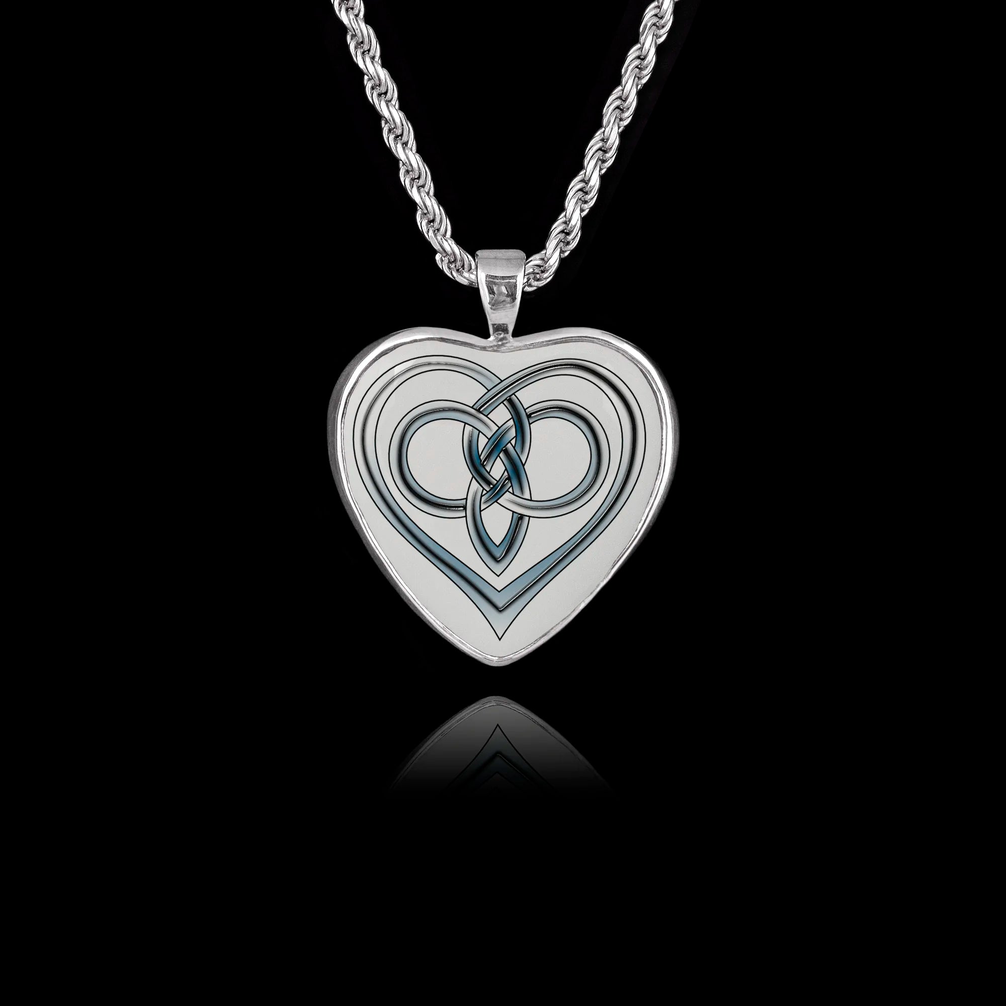 Heart-shaped 925 sterling silver pendant featuring a ceramic insert with an intricate Celtic love knot design. Main image