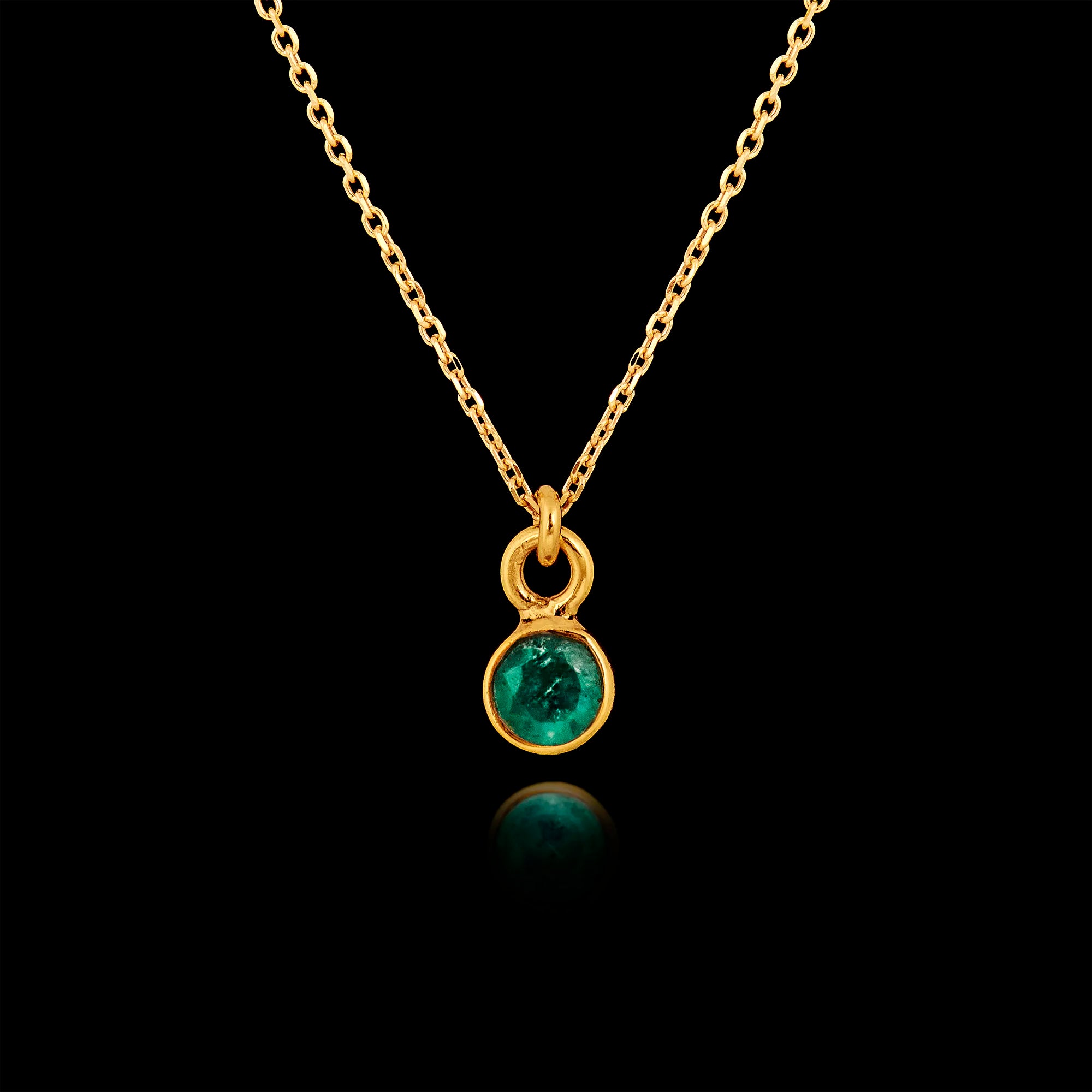 Gold plated 925 sterling silver pendant necklace featuring a round 5mm emerald gemstone on an adjustable chain.