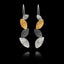 Pair of earrings with hammered gold and silver leaf-like designs on a black background