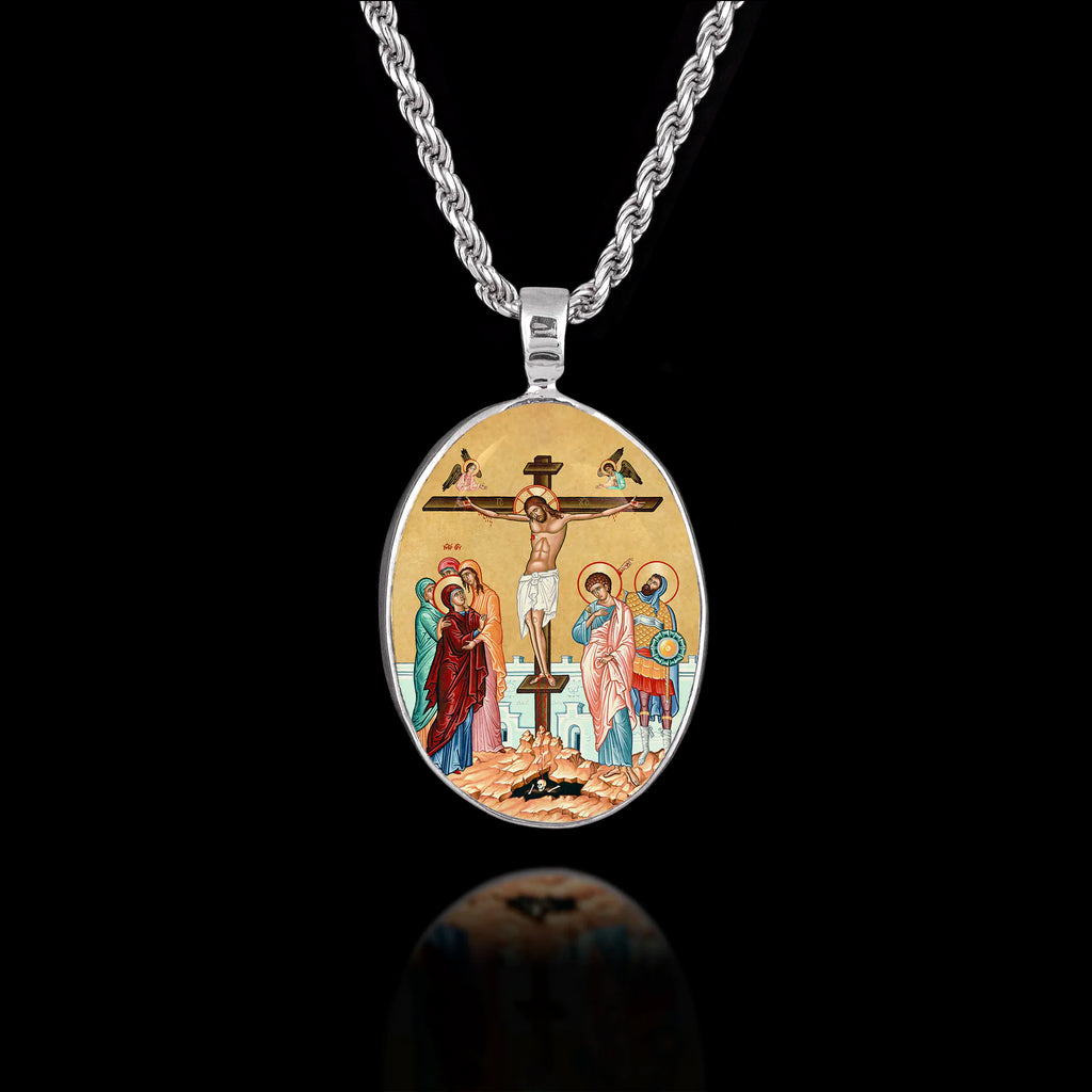 Oval 925 sterling silver pendant featuring a Byzantine icon of the Crucifixion of Jesus with Mary, John, and the skull of Adam.