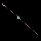 Full view of the gold plated 925 sterling silver chain bracelet featuring a round turquoise gemstone and an adjustable extender chain.