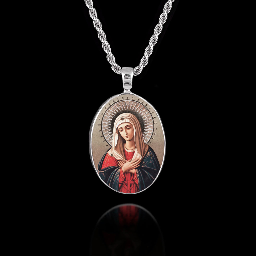 Oval 925 sterling silver pendant featuring the "Tenderness" (Umilenie) icon of the Virgin Mary with hands crossed and a halo.