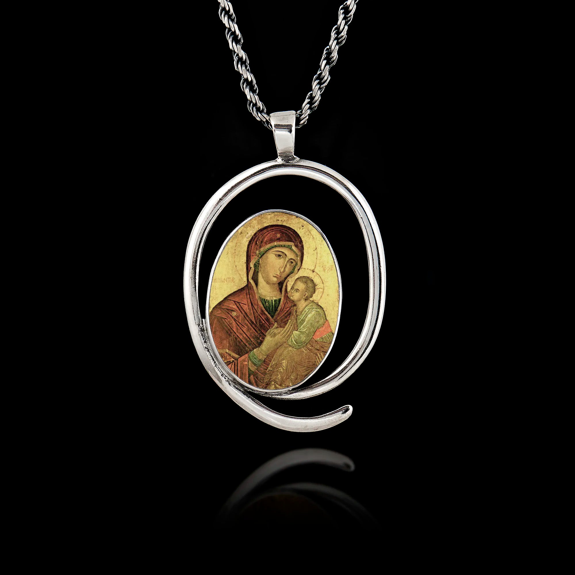 Oval 925 sterling silver pendant with a spiral frame featuring a Byzantine icon of the Virgin Mary holding the Baby Jesus. Main image