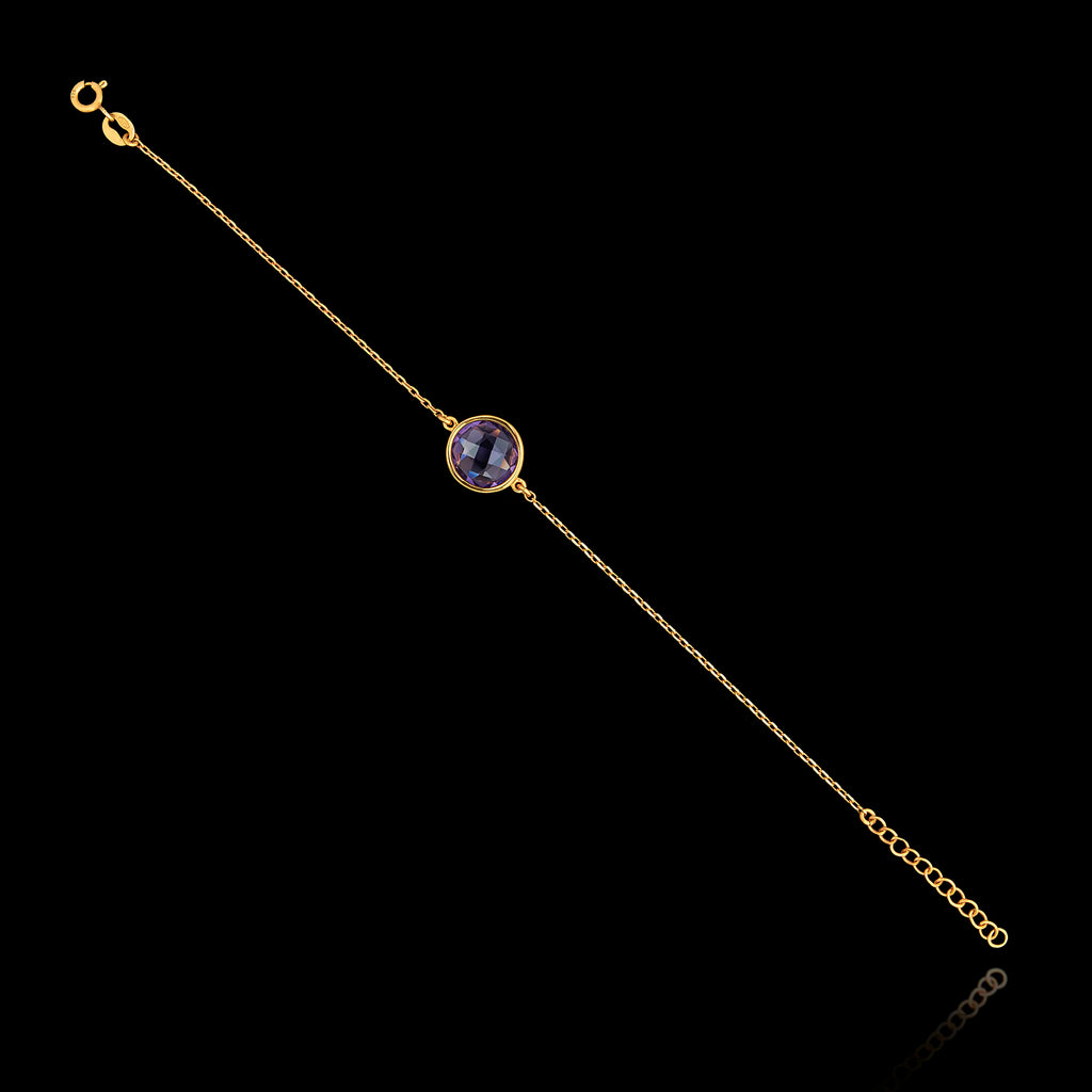 Full view of the gold plated 925 sterling silver chain bracelet featuring a round faceted synthetic amethyst purple gemstone and an adjustable extender chain.