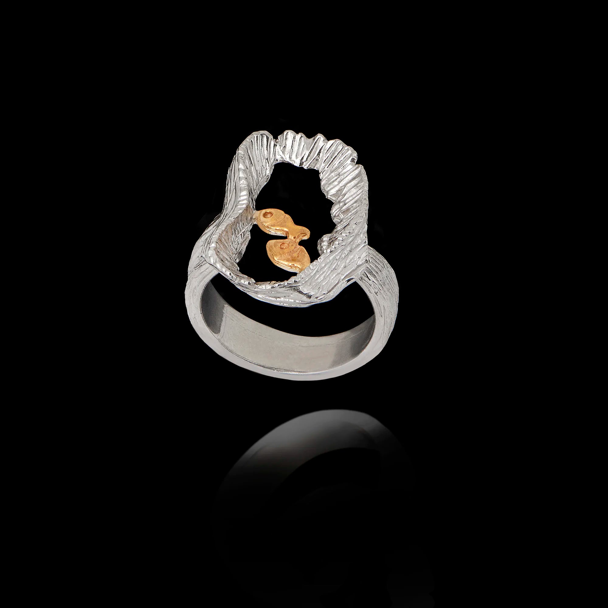 Silver ring with gold fish on a black background Main image