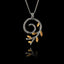 a silver spiral olive branch pendant on a chain, featuring an oxidized stem and gold-plated leaves.
