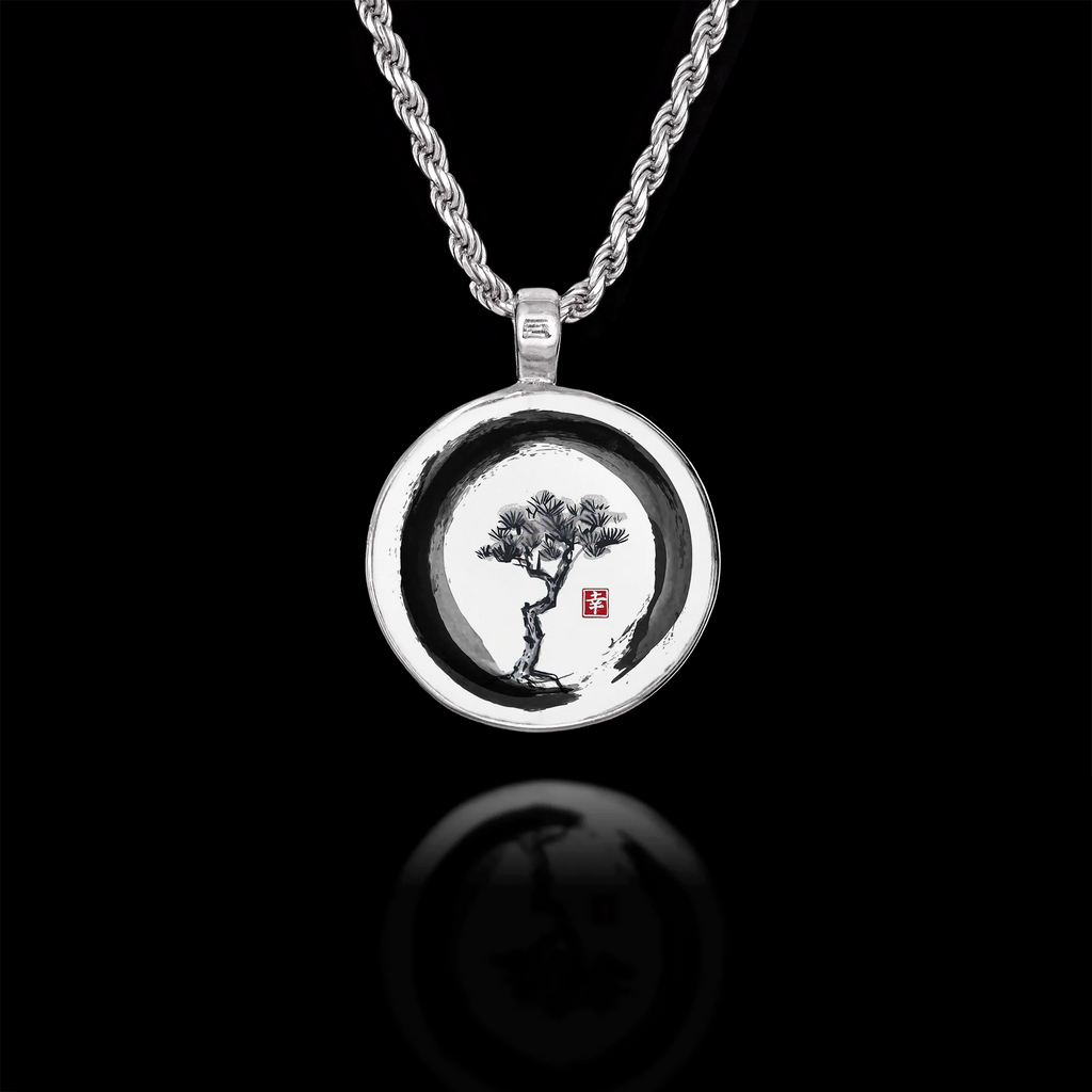 Round 925 sterling silver pendant featuring a Japanese ink wash painting of a pine tree inside an Enso circle.