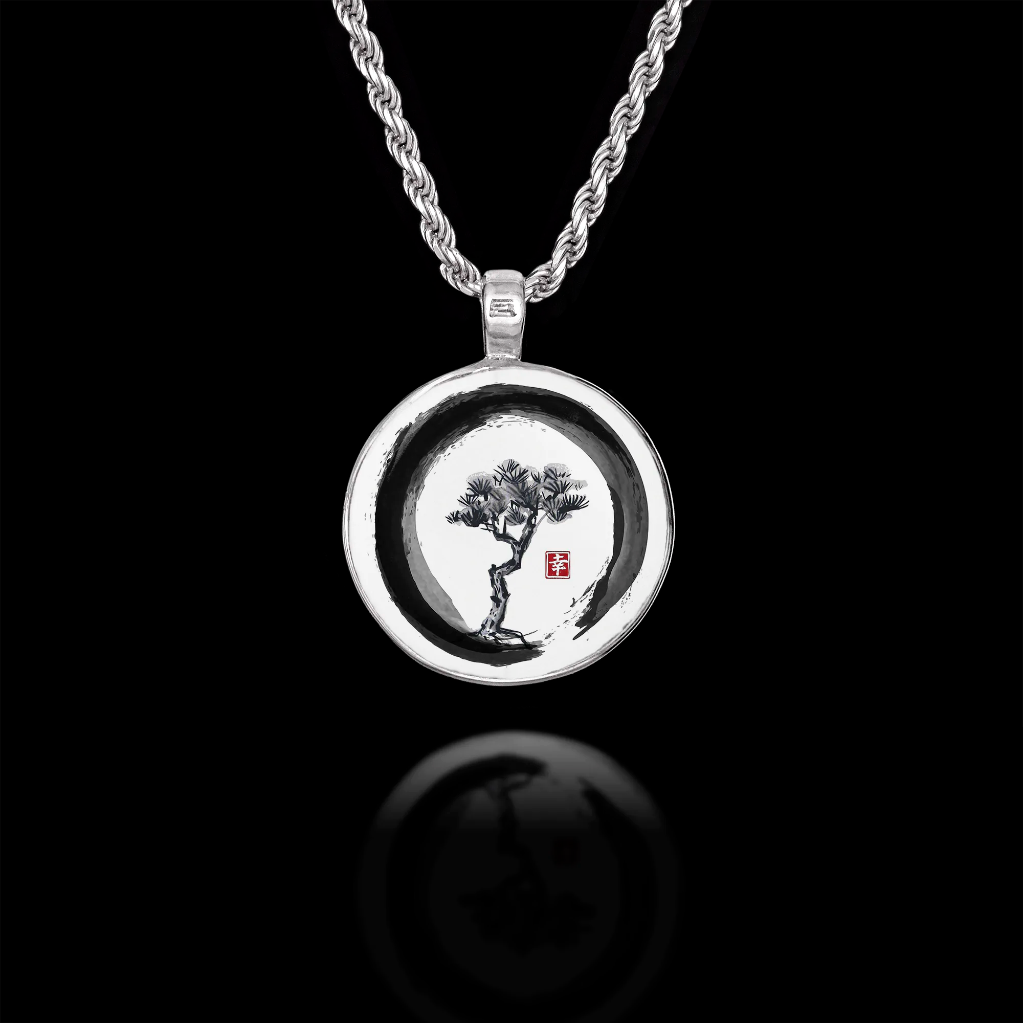 Round 925 sterling silver pendant featuring a Japanese ink wash painting of a pine tree inside an Enso circle. Main image