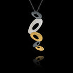 Necklace with circular pendant on a black background