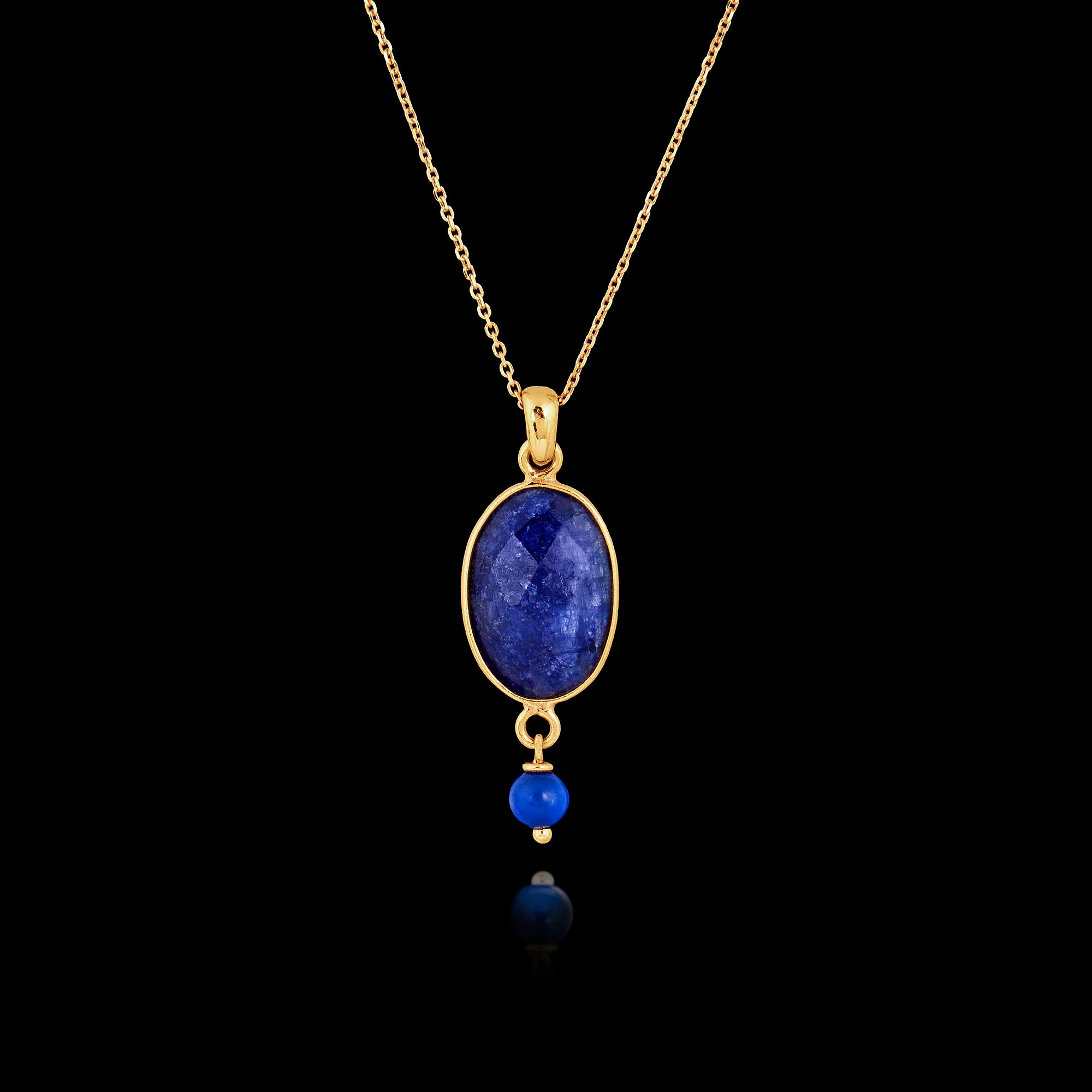 Gold plated 925 sterling silver pendant necklace featuring a large oval lapis lazuli gemstone with a small blue bead dangle on an adjustable chain. Main image