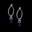 Silver hoop earrings with blue gemstones on a black background