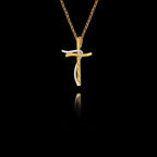 Side angle view of a handcrafted 925 sterling silver two-tone cross pendant showing the interplay between the gold-plated textured cross and the rhodium-plated curved accent, on a gold chain.