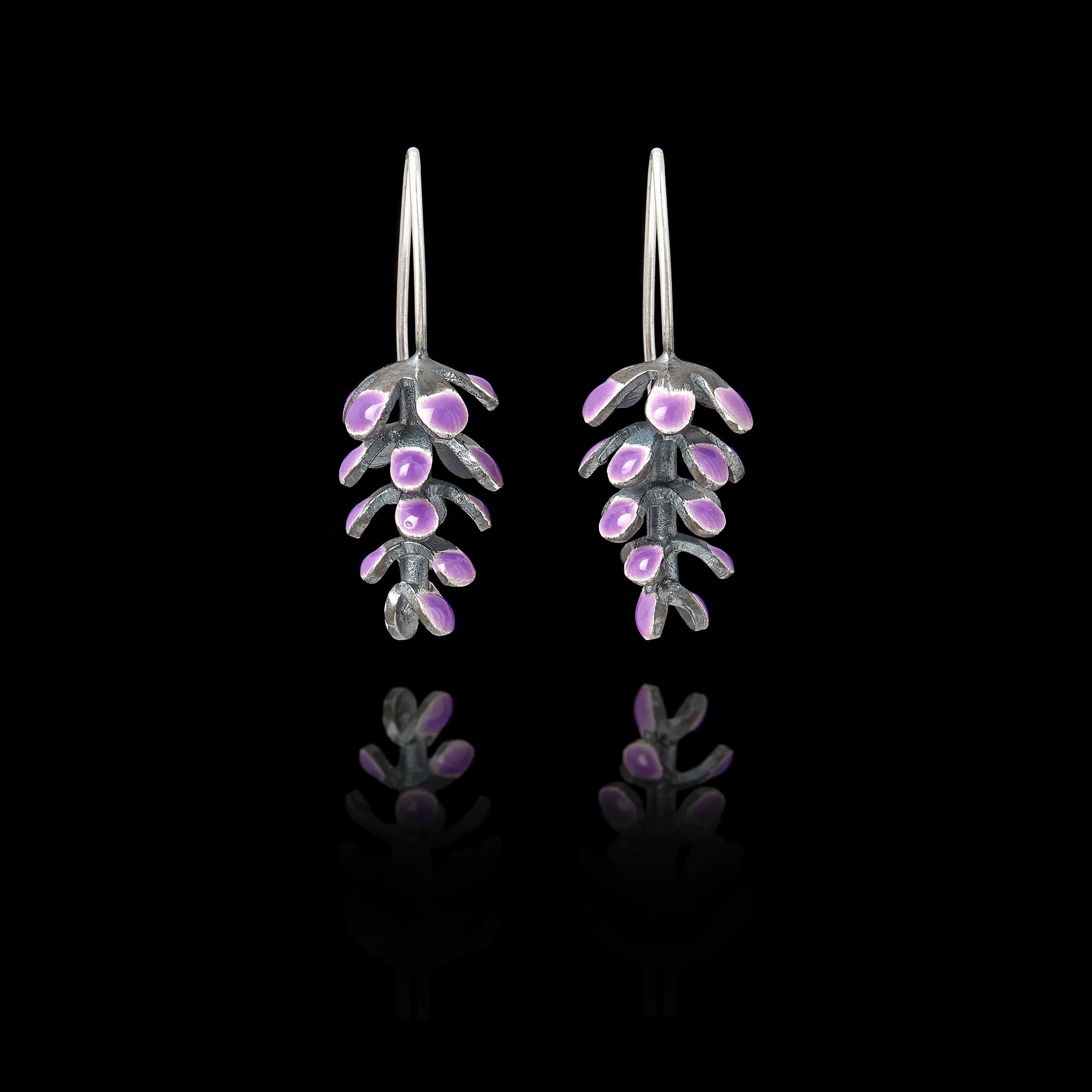 Front view of handcrafted silver earrings shaped like lavender sprigs with oxidized silver stems and purple enamel buds. Main image