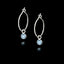 Pair of 925 sterling silver teardrop hook earrings featuring small round, slightly translucent light blue aquamarine gemstones in silver bezel settings.