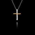 Handcrafted 925 sterling silver two-tone cross pendant with a rhodium-plated textured vertical bar and gold-plated horizontal bar, hanging on a silver chain against a black background.