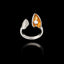 Front view of an adjustable silver ring featuring a textured shell and an open mussel shell with a gold interior and a pearl.