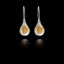 Front view of silver teardrop earrings with  gold cluster of fig seeds inside.