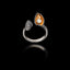 Front view of an adjustable 925 sterling silver ring with a dark oxidized finish, featuring an open mussel shell with a gold-plated interior and a pearl.
