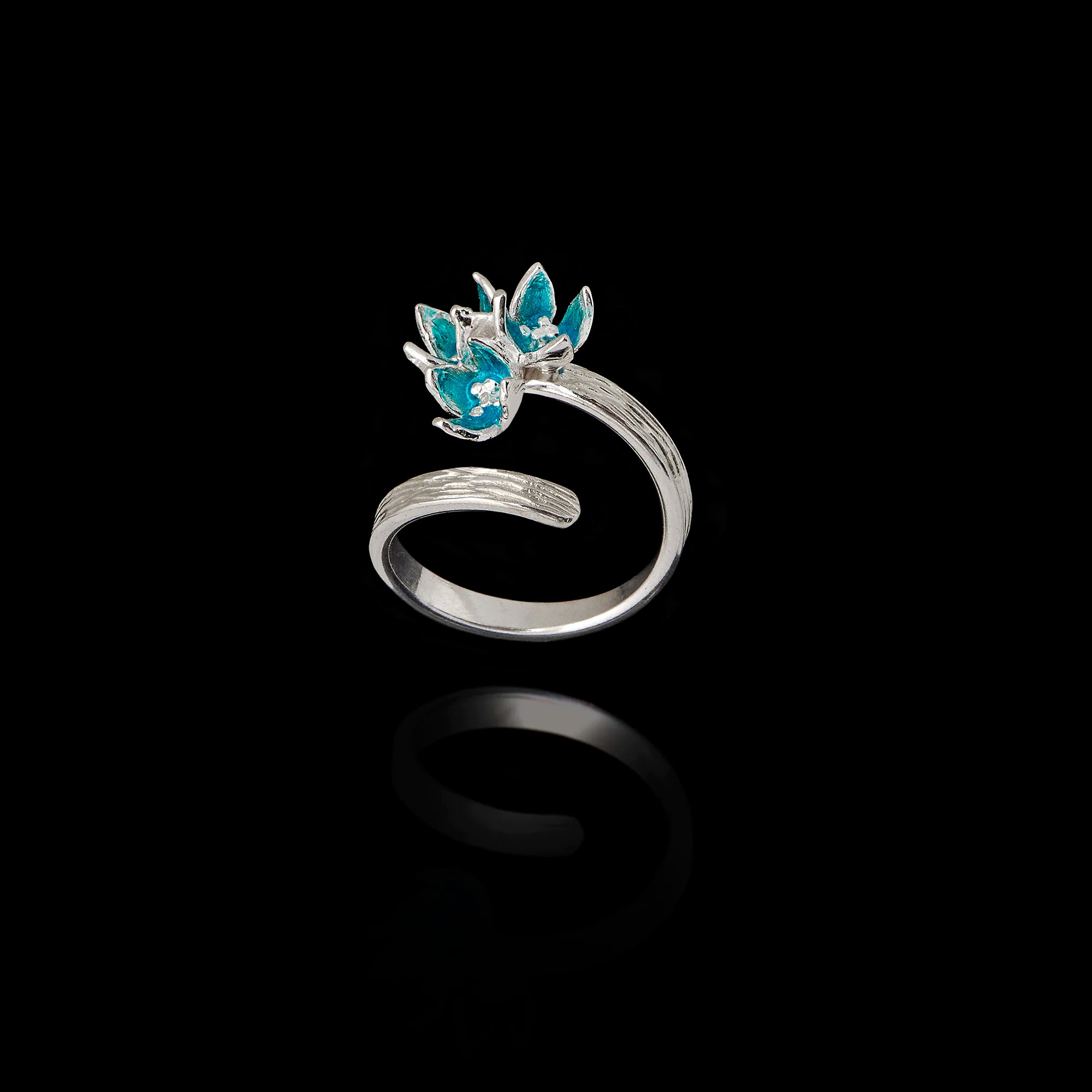 Perspective view of an adjustable 925 sterling silver wrap ring featuring three flowers with turquoise enamel petals. Main image