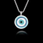 Round 925 sterling silver pendant featuring the traditional blue, turquoise, and white Evil Eye (Mati) symbol.