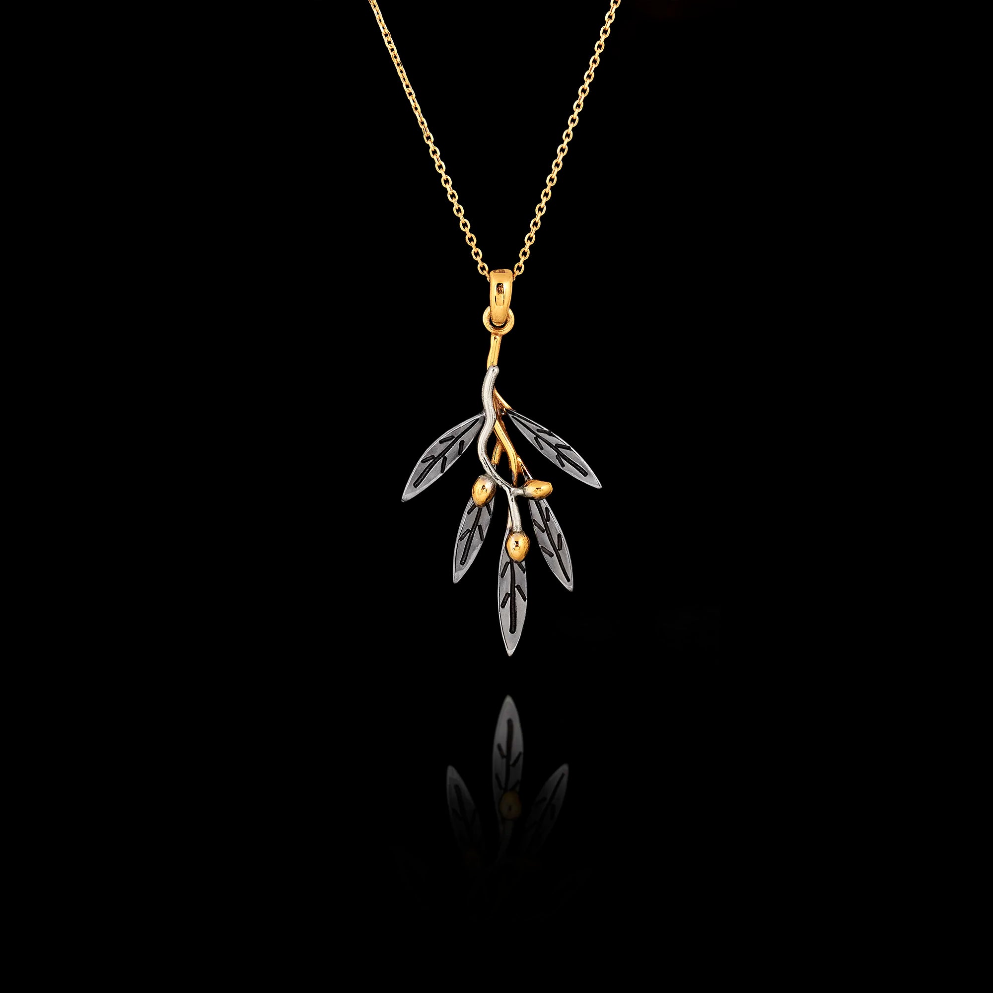 Two-tone 925 sterling silver pendant necklace featuring a gold-plated olive branch with rhodium-plated silver leaves on an adjustable gold chain.
