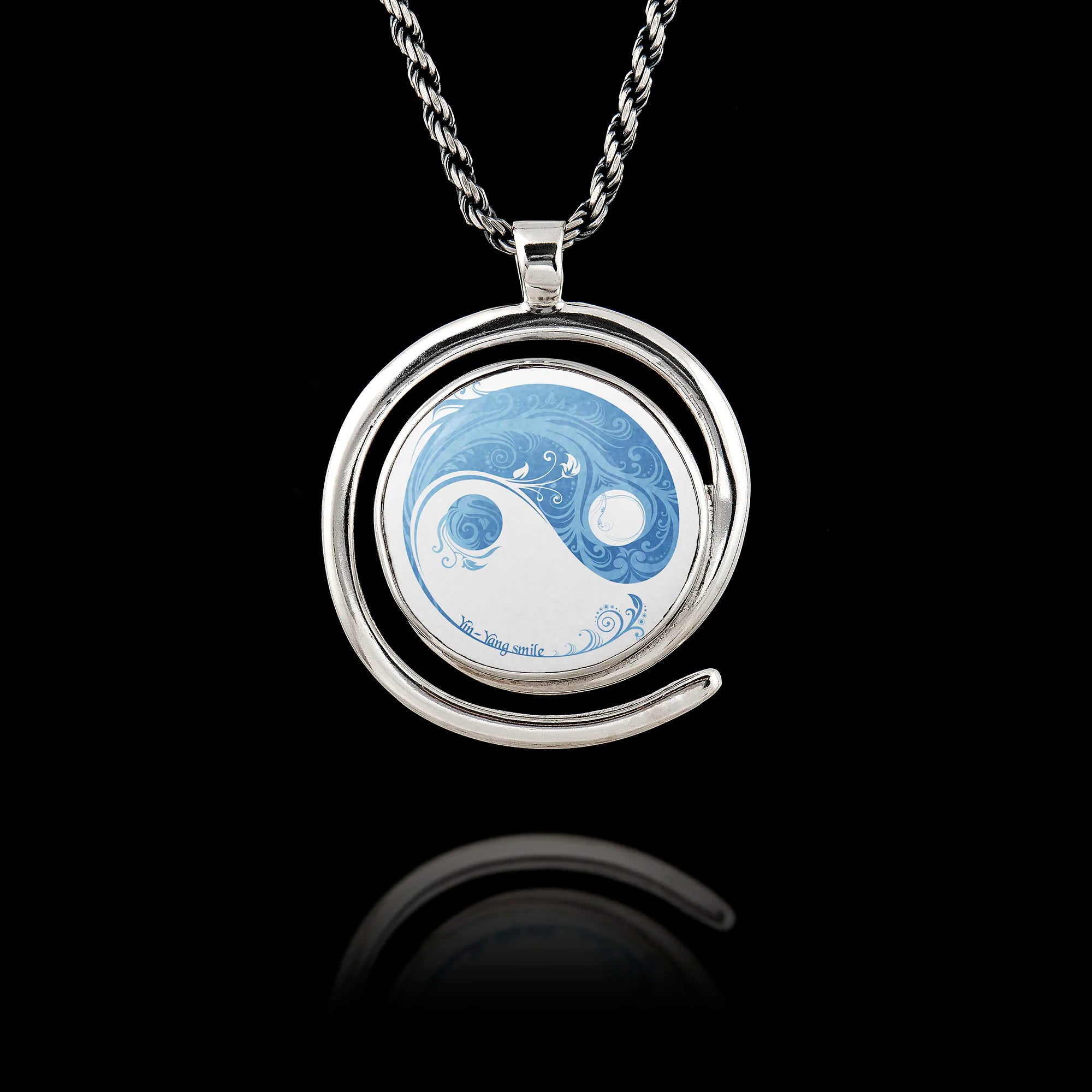 Round 925 sterling silver pendant with a spiral frame featuring a blue and white floral Yin Yang design. Main image