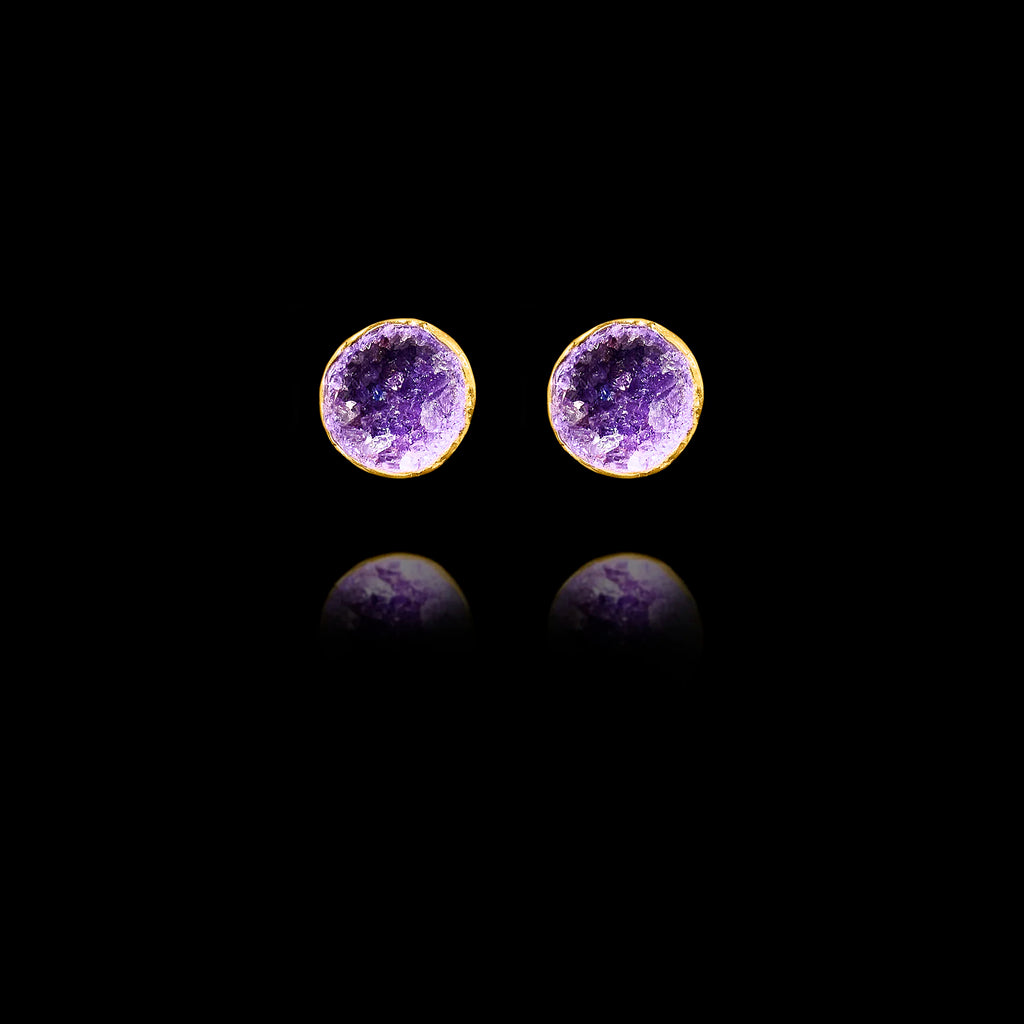 Front view of gold stud earrings featuring circular purple amethyst druzy stones.