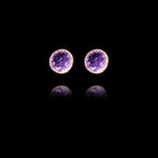 Front view of gold stud earrings featuring circular purple amethyst druzy stones.