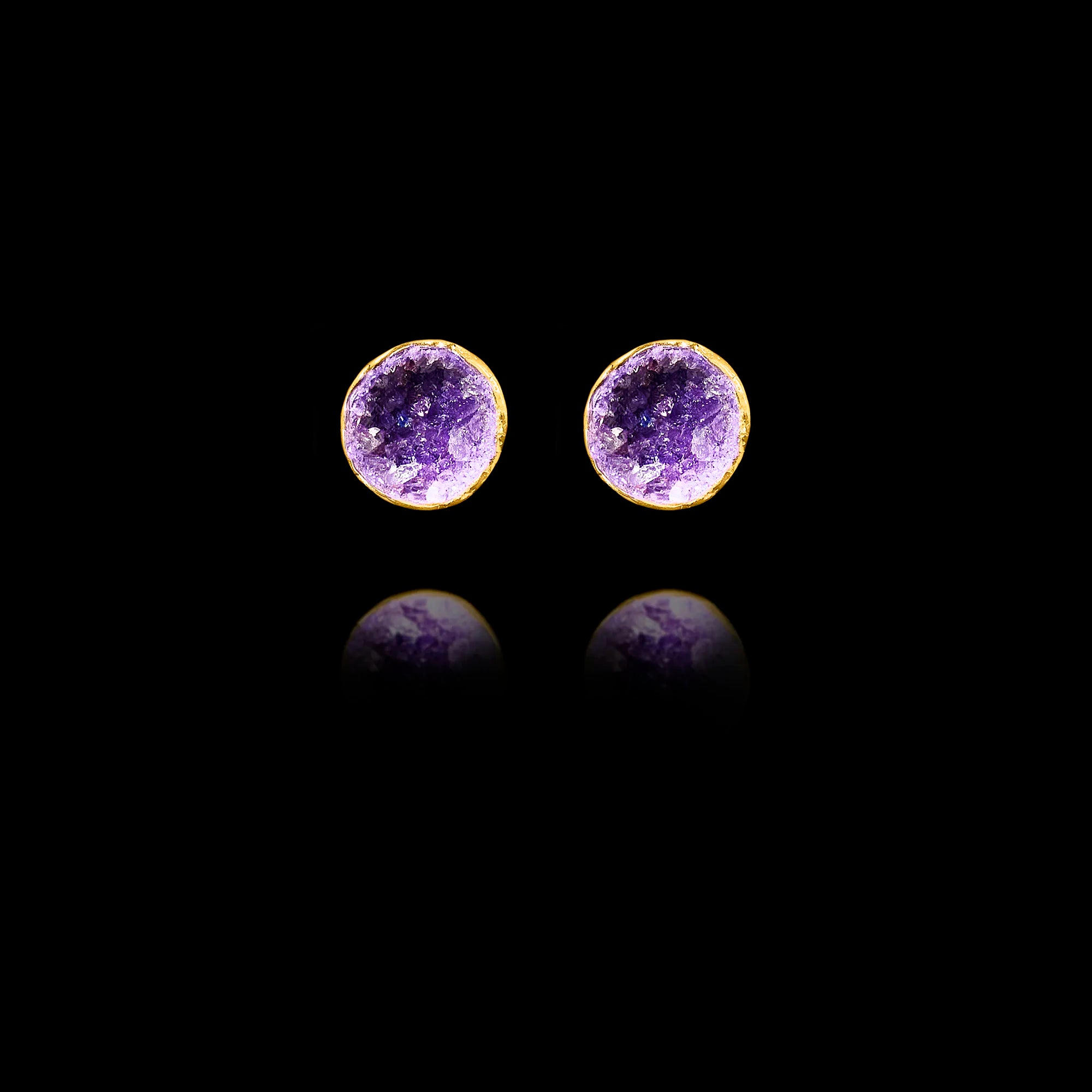 Front view of gold stud earrings featuring circular purple amethyst druzy stones.