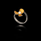 Side view showing the adjustable band and the detailed, textured petals of the oxidized floral ring.