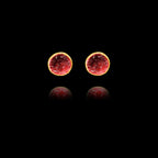 Front view of gold stud earrings featuring circular crimson garnet druzy stones