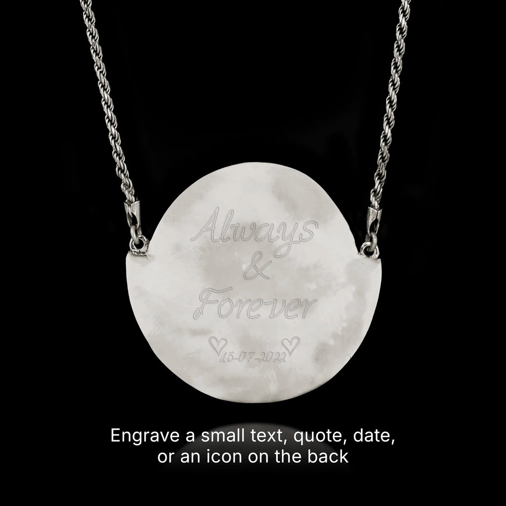 Silver necklace with a round pendant engraved with 'Always & Forever' on a black background.