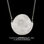 Silver necklace with a round pendant engraved with 'Always & Forever' on a black background.