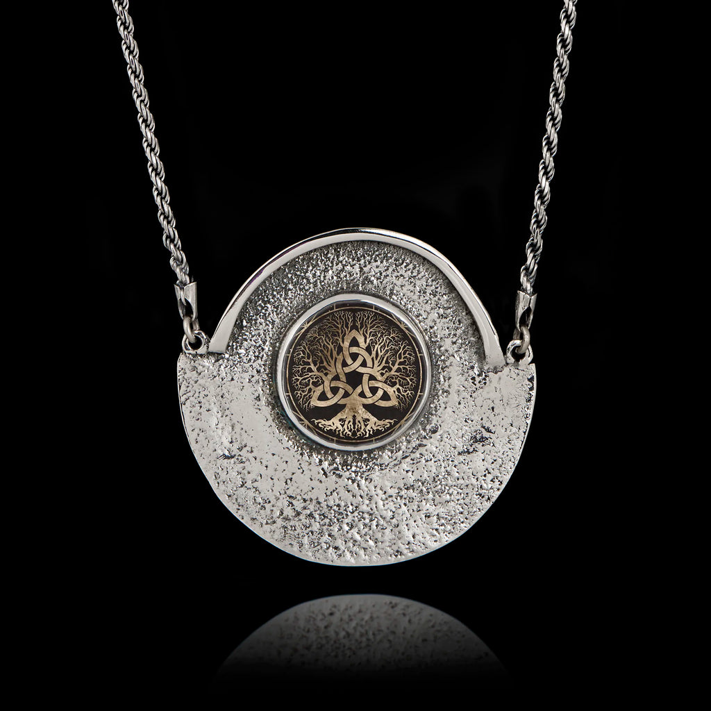 Unique 925 sterling silver statement necklace featuring a round ceramic Tree of Life with Celtic knots, set in a textured hammered silver crescent frame.