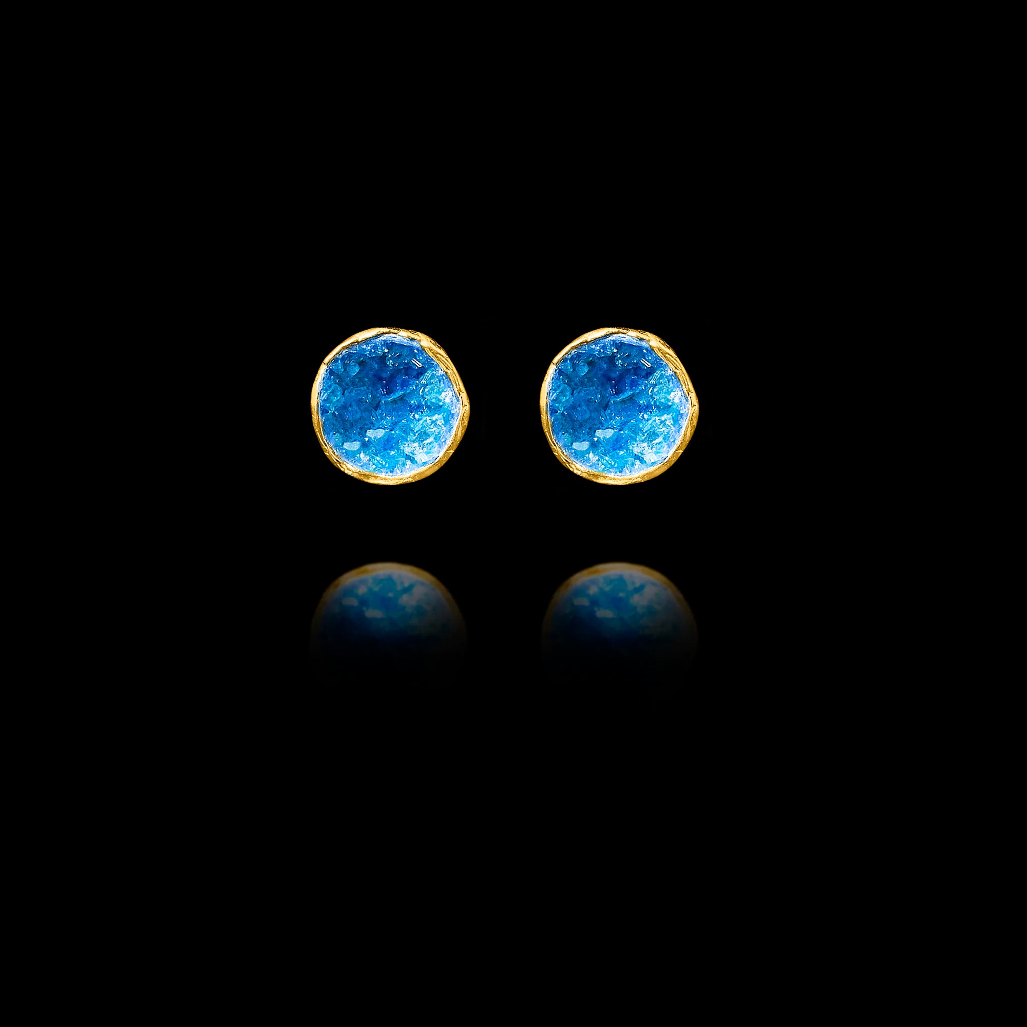 Front view of gold stud earrings featuring circular blue agate druzy stones. Main image
