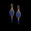 Long gold hook earrings featuring large oval lapis stones and smaller round lapis beads suspended below in gold settings.