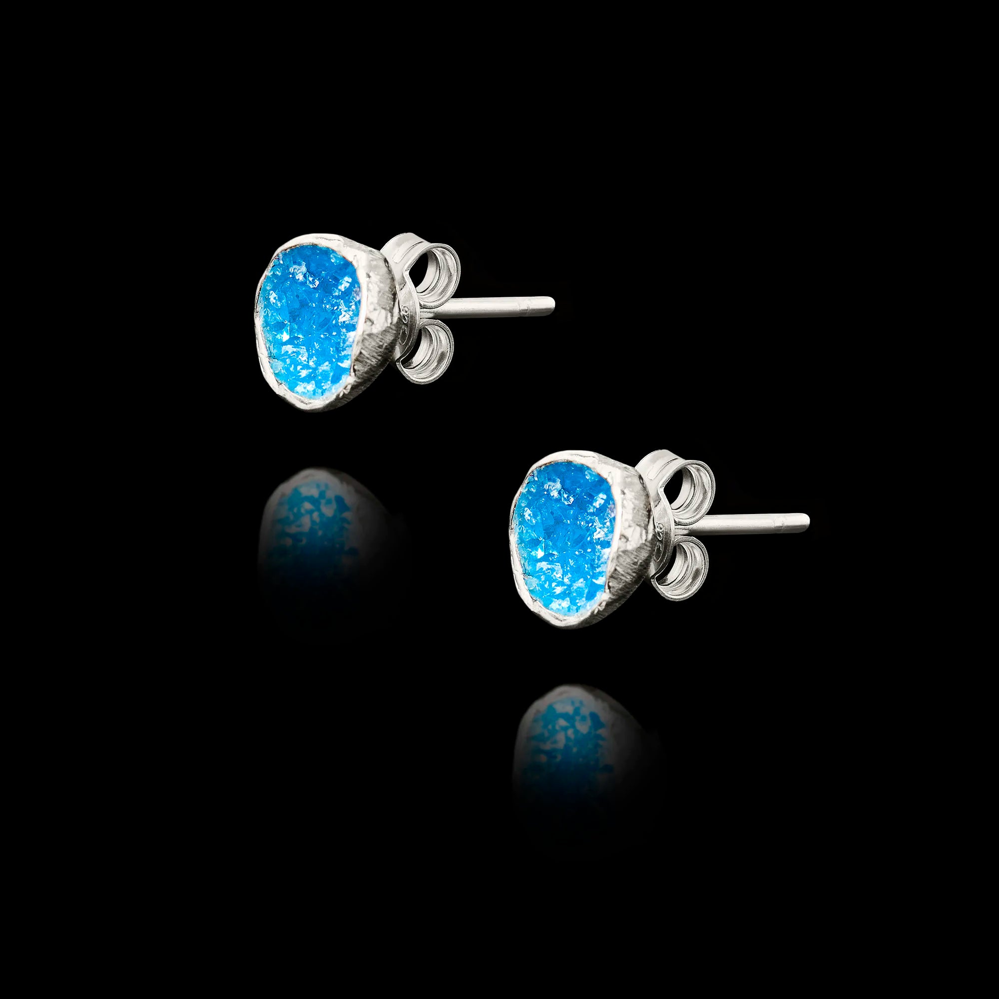 Side view of the blue agate silver studs showing the natural gemstone texture and secure butterfly post fastening.