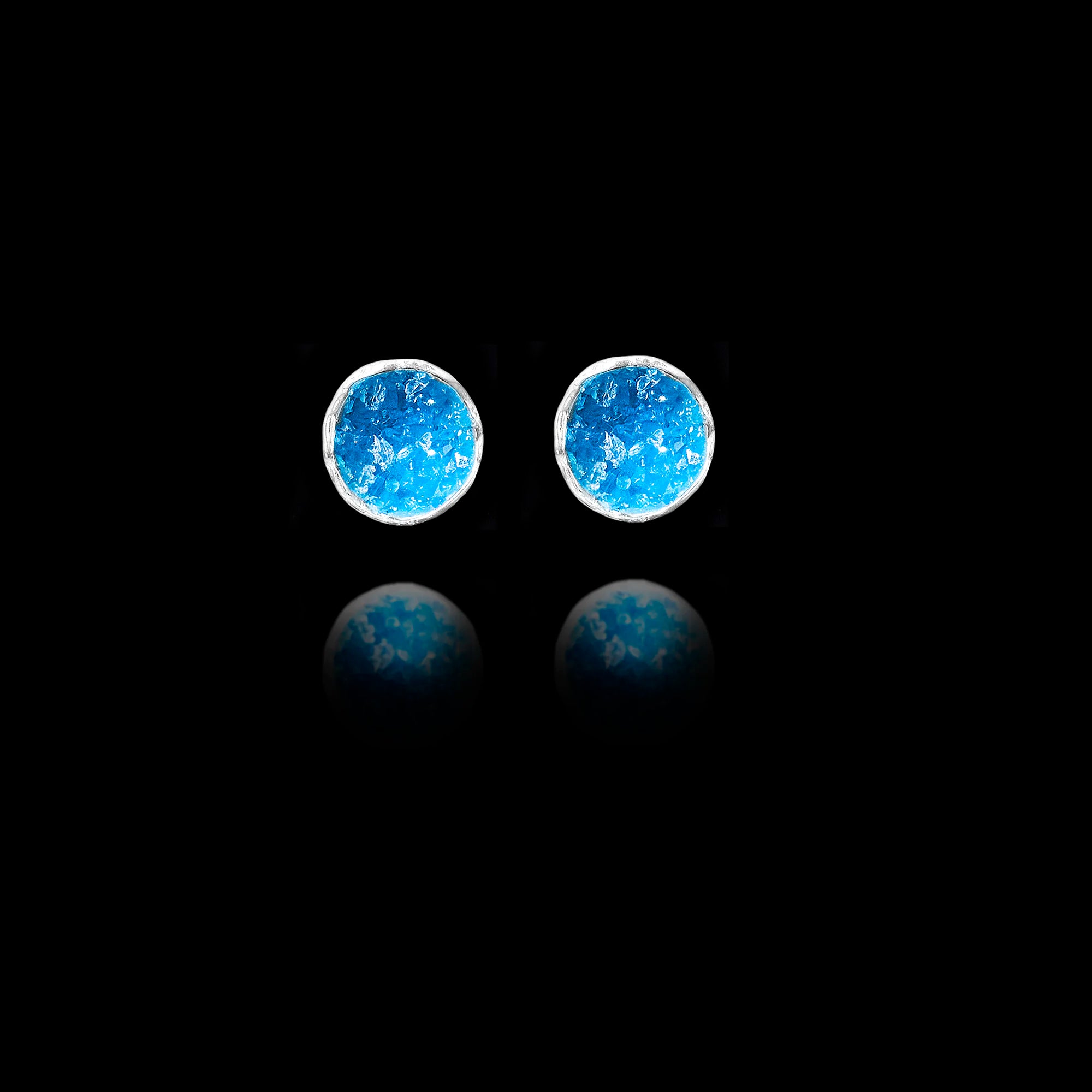 Front view of  silver stud earrings featuring circular blue agate druzy stones. Main image